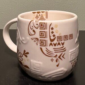 STARBUCKS Three Regions Aztec Gold & White Embossed New Bone China Mug 2012